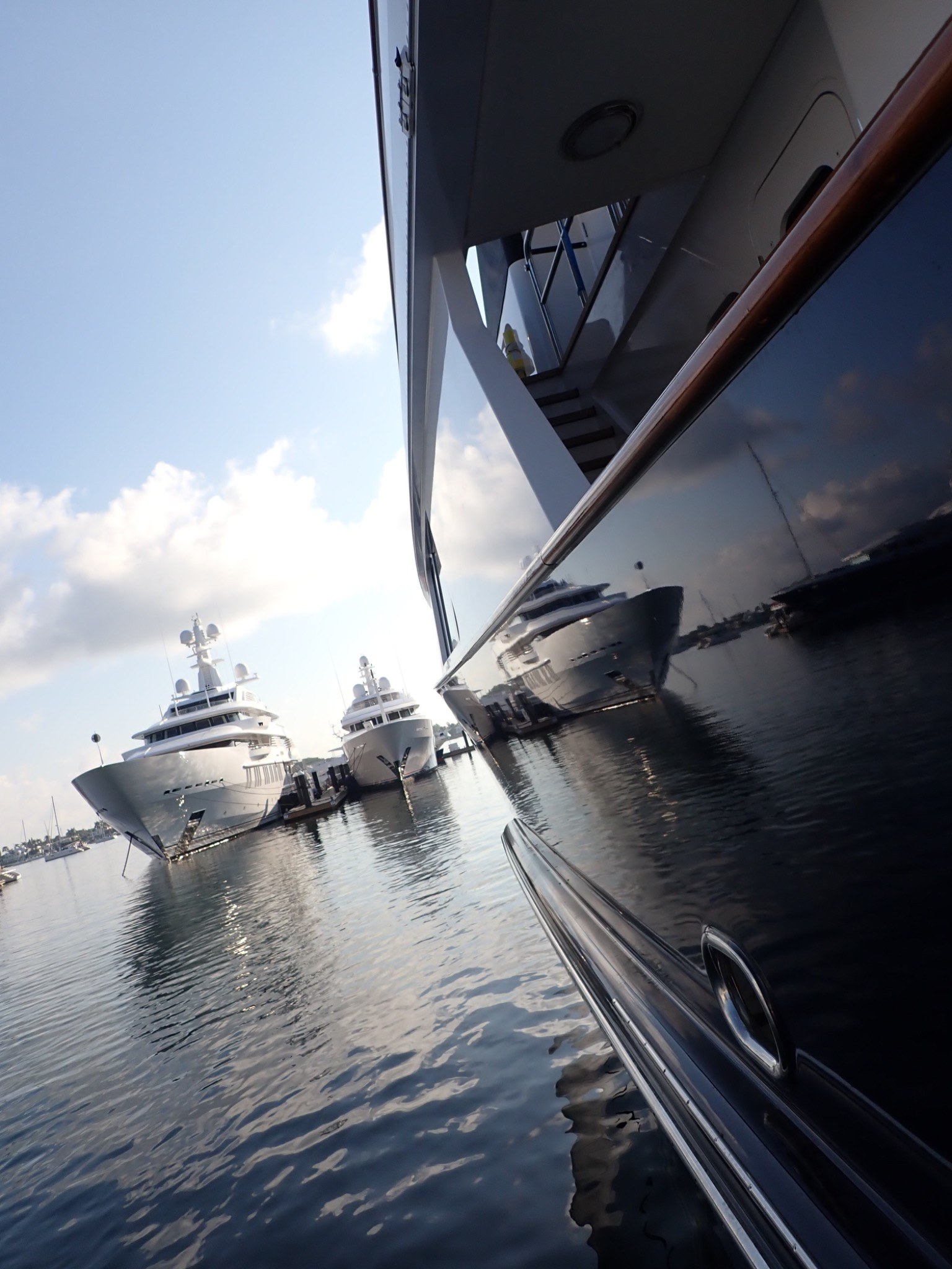 Dark blue yacht hull showing a high-gloss reflective finish in natural light