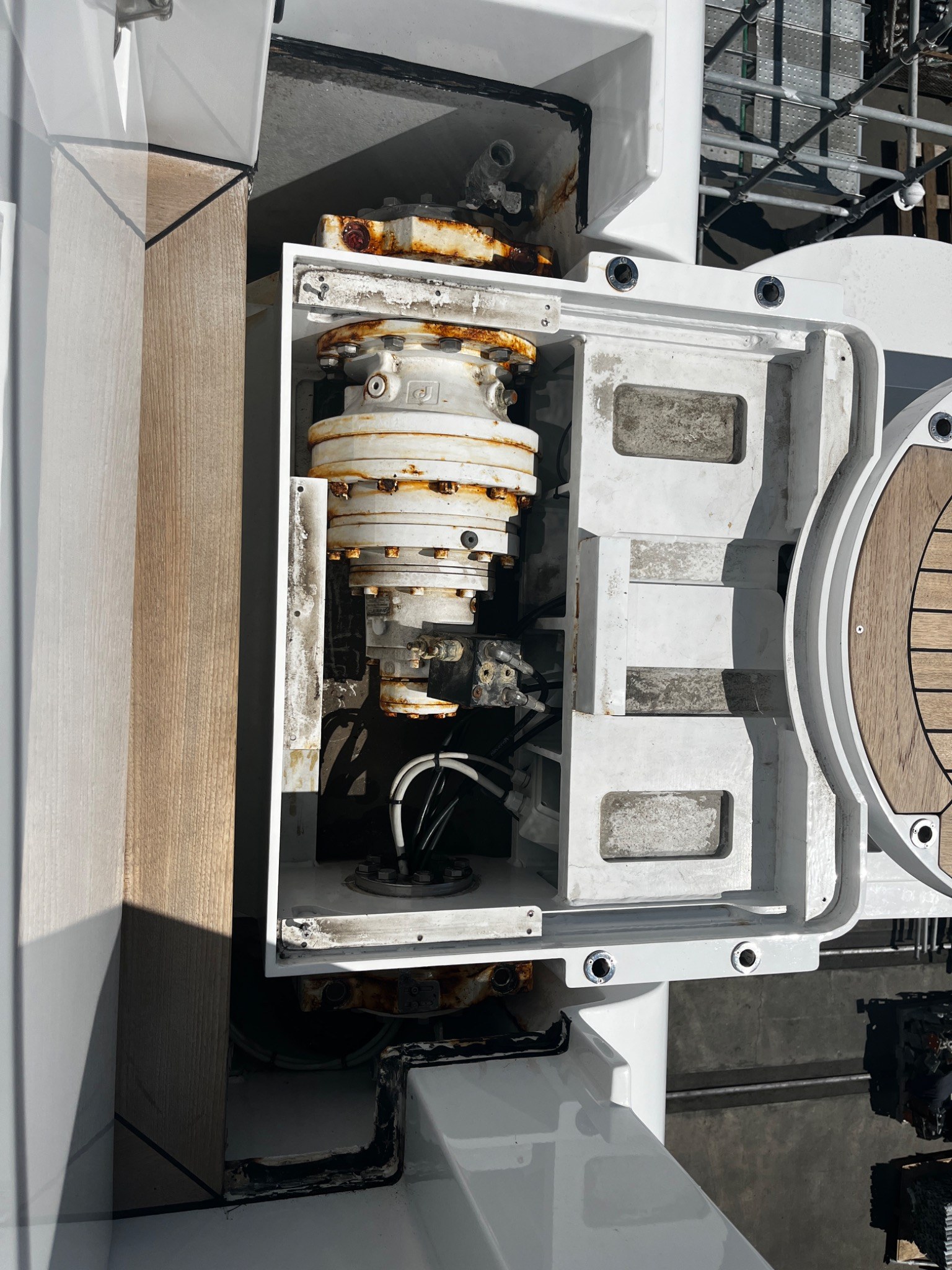 Corrosion and rust staining on yacht deck machinery, fasteners and flanges