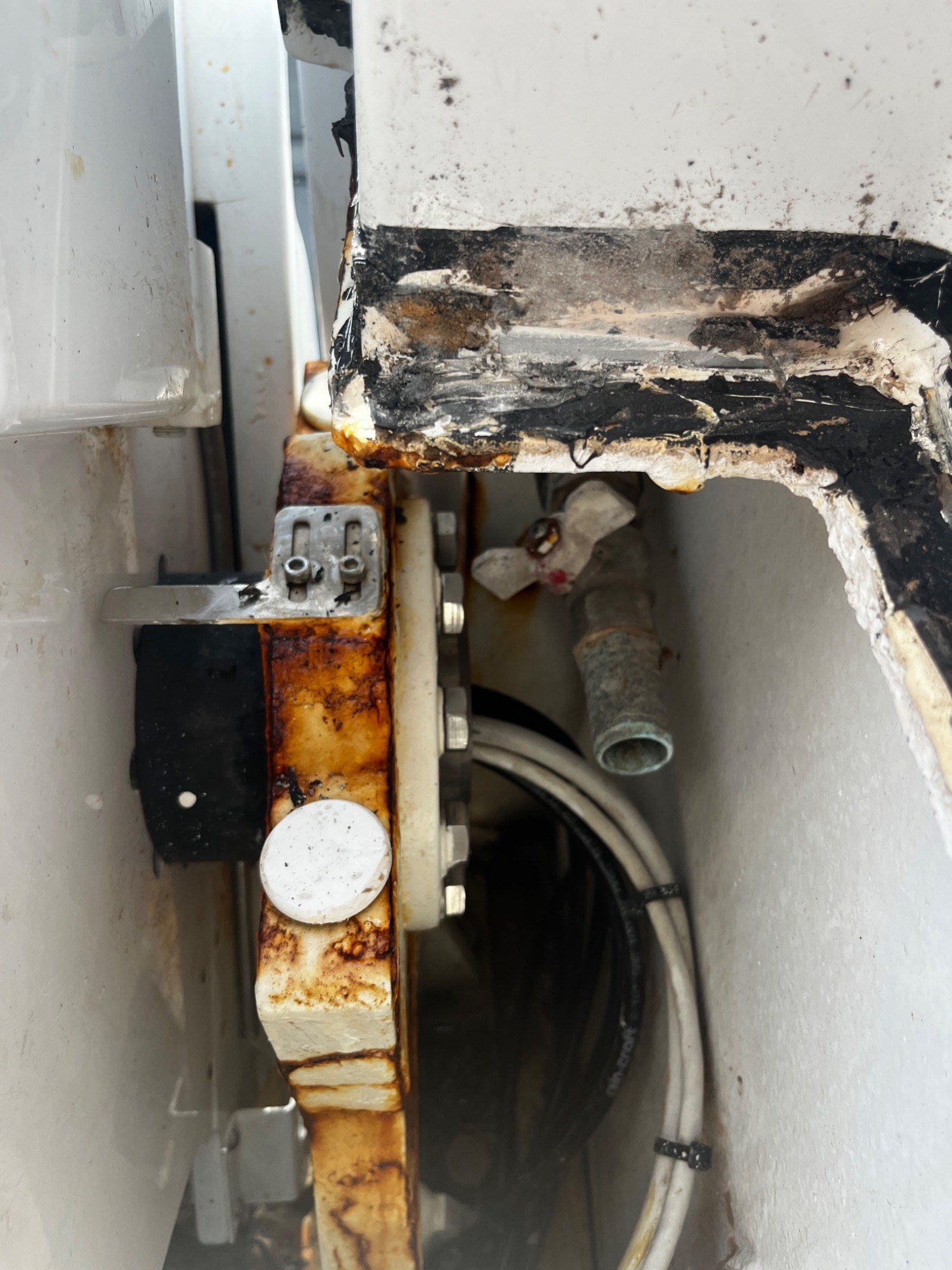 Localized rust and corrosion at a yacht structural and machinery interface