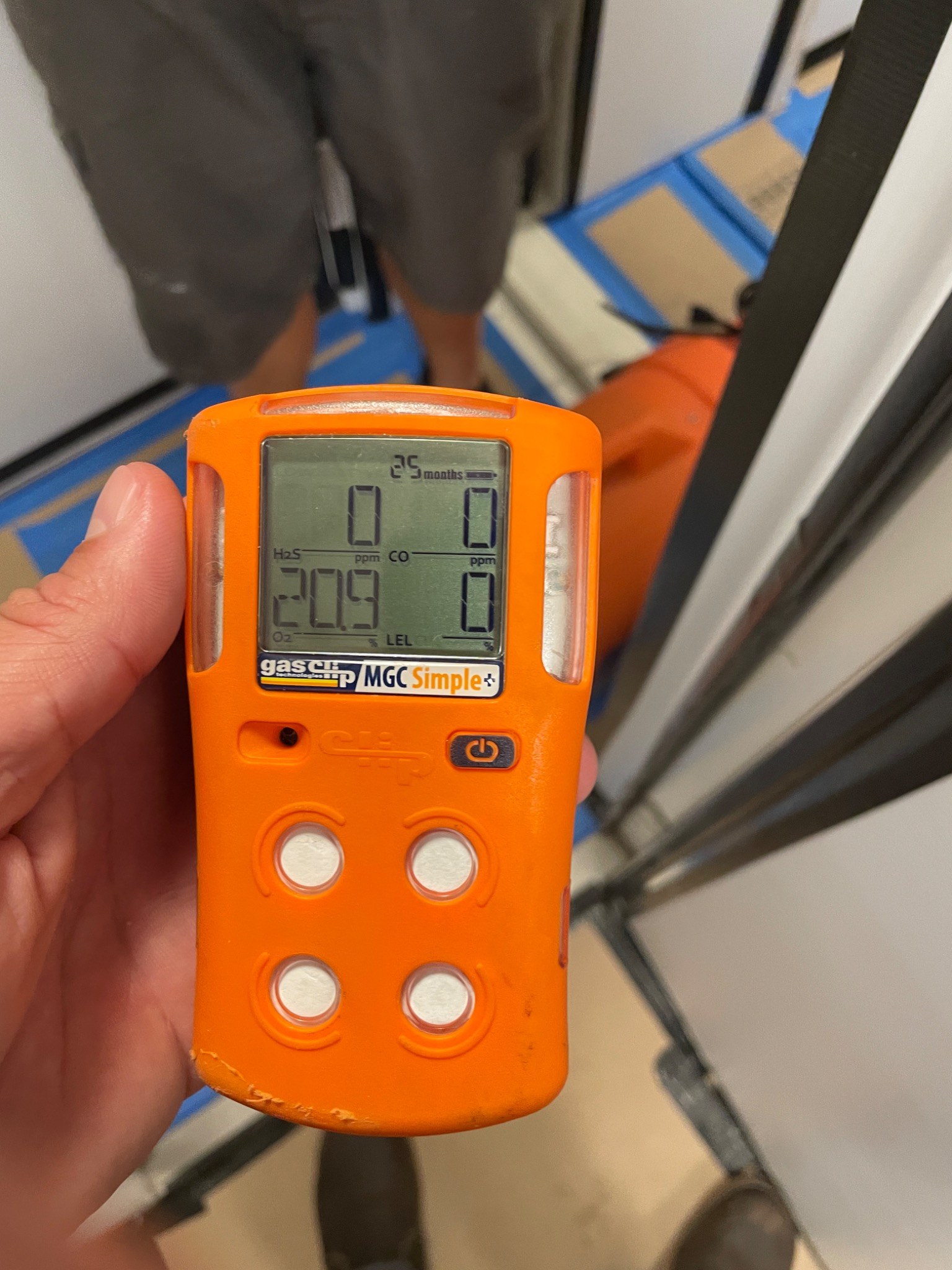 Portable multi-gas instrument displaying recorded field readings aboard a yacht